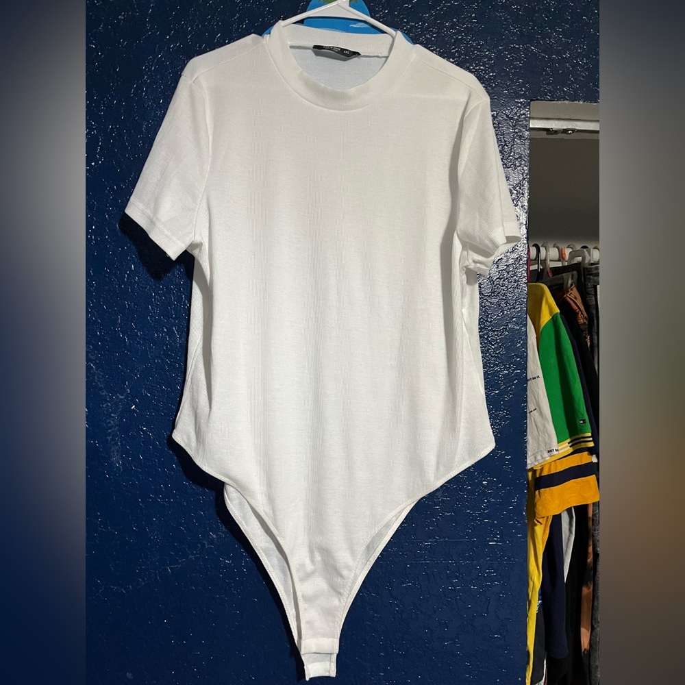 NEVER worn body suit, runs small